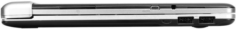 Side view of a silver and black tablet showing USB ports, memory card slot, and security lock slot; brand/model not specified.