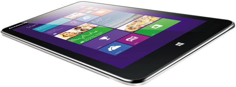 Microsoft Surface tablet from a low side angle, showing Windows OS home screen with colorful tiles on a white background.