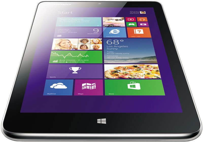 Lenovo tablet (model unspecified) in black, front angled view, showing colorful Windows start screen with app tiles.