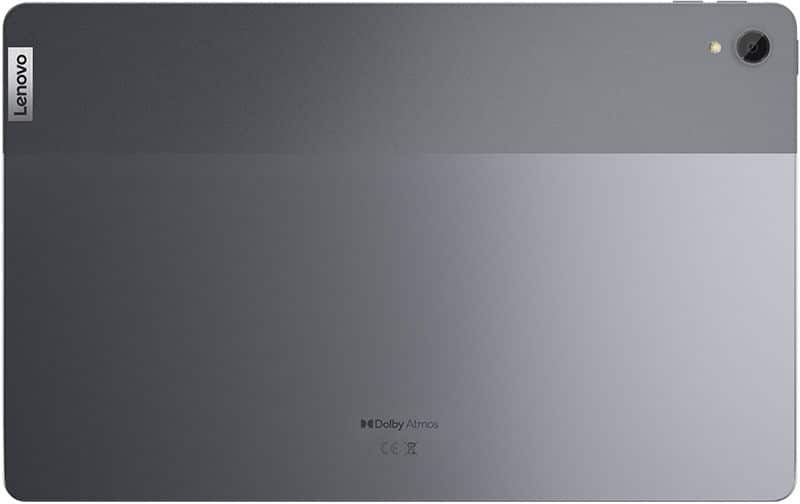 Rear view of Lenovo tablet in gray, showing Lenovo logo (top left), rear camera (top right), and Dolby Atmos branding (center).
