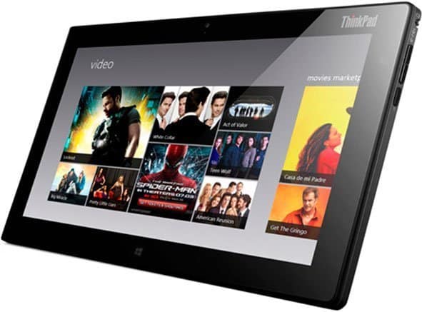 Lenovo ThinkPad tablet, front view, showing movie and TV show thumbnails such as Spider-Man and White Collar on the display.