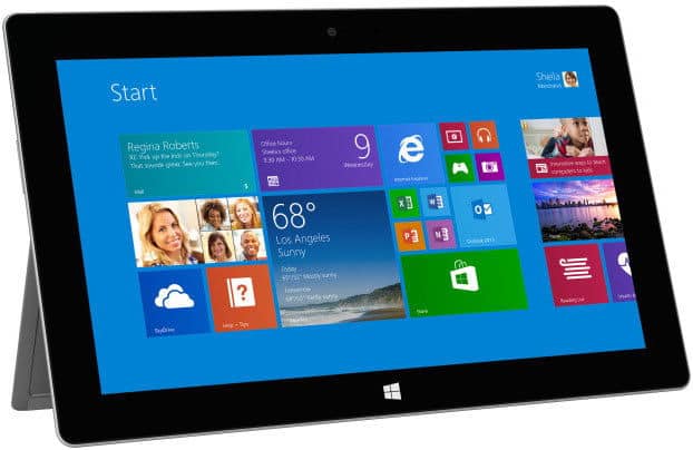 Front view of Microsoft Surface tablet showing Windows 8 Start screen with app tiles and Los Angeles sunny weather.