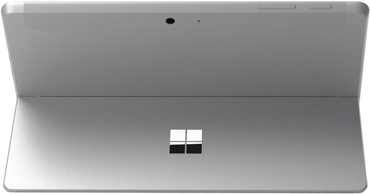 Rear view of a silver Microsoft Surface tablet with kickstand extended, centered logo, rear camera, and top-edge buttons visible.