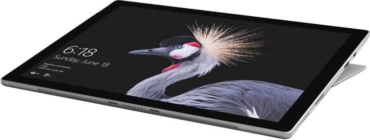 Front view of Microsoft Surface tablet in landscape mode, screen on, kickstand partially extended. Lock screen shows 6:18 and crane.