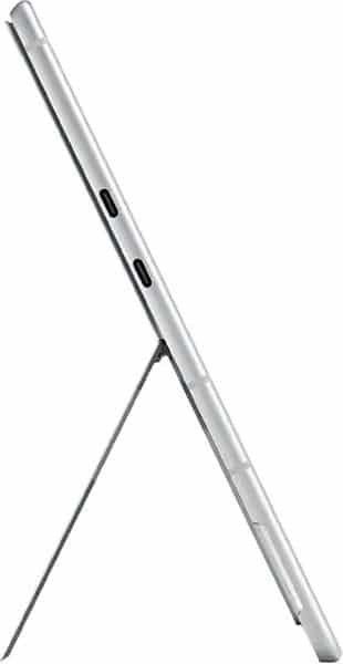 Side view of a thin silver tablet on its kickstand, displaying dual USB-C ports and volume buttons along the edge.