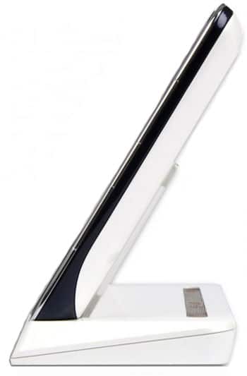 Side view of a slim cordless landline phone on a white charging base; handset profile is similar to modern tablet designs.