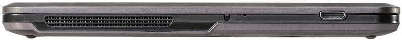Closed laptop side view showing a cooling vent and one rectangular port on the right; specific brand and model not visible.
