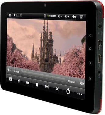 Front view of a black tablet showing a paused video scene with castle and pink trees; playback controls and side ports visible.