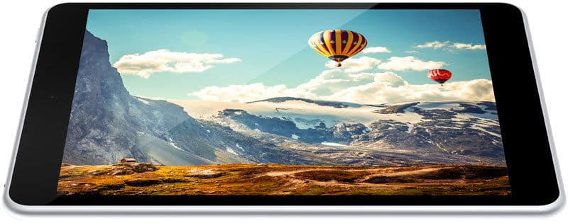 Front view of a tablet displaying a vivid mountain landscape with snowy peaks and two colorful hot air balloons on screen.