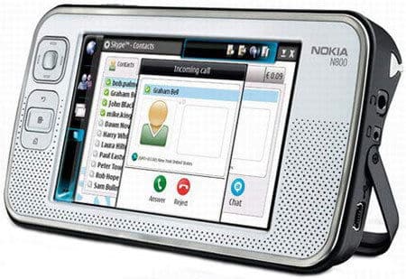 Front view of Nokia N800 Internet Tablet showing Skype call screen, touchscreen, side buttons, and stand on the right.
