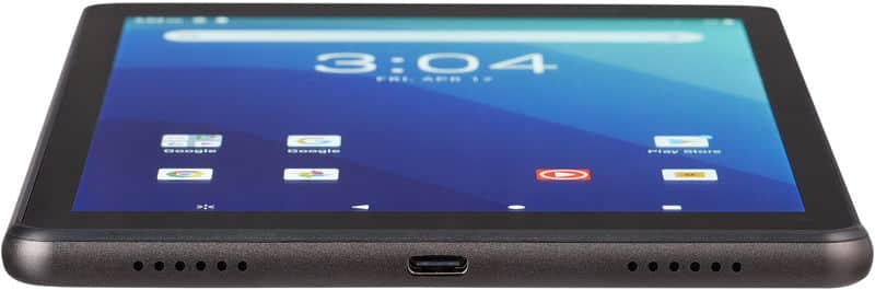Front close-up of a black tablet on a flat surface, home screen visible; bottom edge shows charging port and speaker grills.