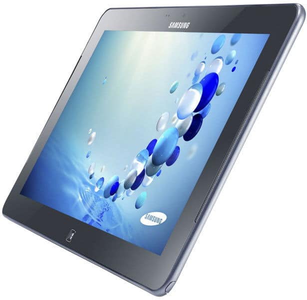 Samsung Galaxy tablet viewed at an angle with screen showing blue and white abstract bubbles over a water-themed background.