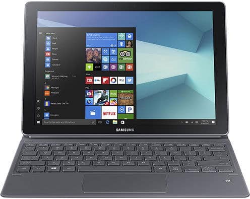 Front view of a Samsung laptop with black keyboard, Windows 10 Start menu and app tiles visible on the screen.