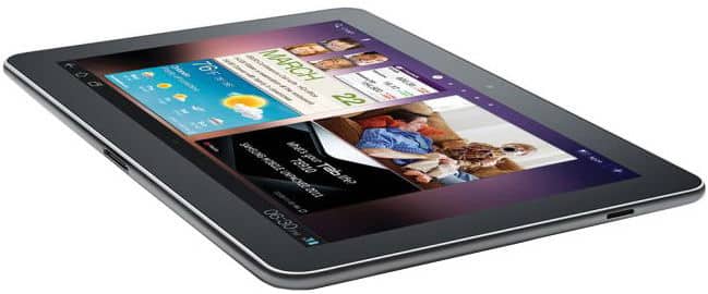 Black tablet with wide screen and thin bezels, angled front view on white; displays weather, calendar, and media widgets.