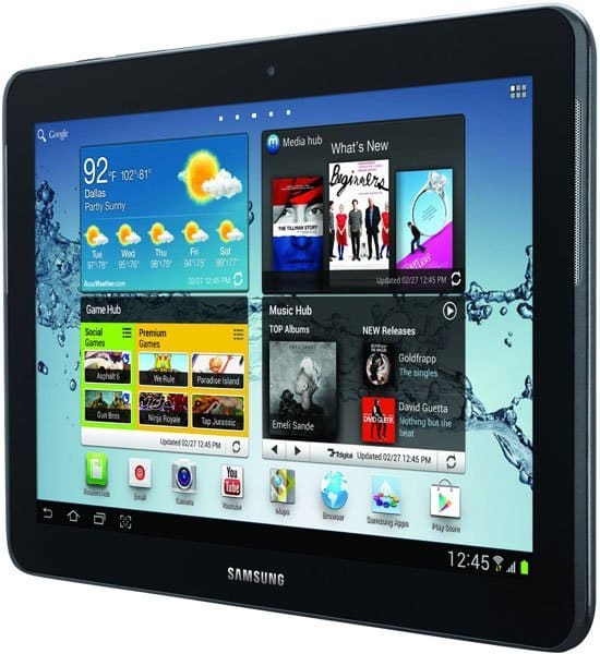 Front view of black Samsung tablet showing home screen with app widgets; weather for Dallas 92°F sunny, time 12:45.