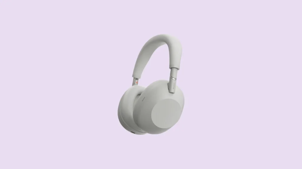 Front view of light gray over-ear headphones for phones, minimalist design, cushioned ear cups, adjustable headband.