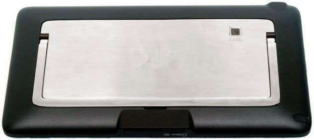 Rear close-up of a black and silver tablet showing metallic back panel and square rear camera in the corner; brand/model not visible.