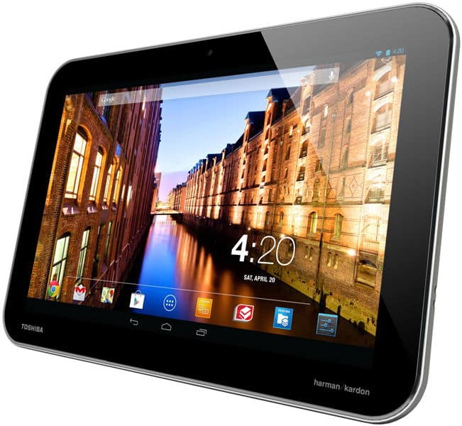 Front view of Toshiba tablet with black frame, cityscape wallpaper, app icons visible; screen shows 4:20, Saturday April 20.
