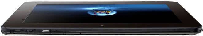 Black tablet, screen facing up with blue background and circular logo, side ports and buttons visible; brand/model not specified.
