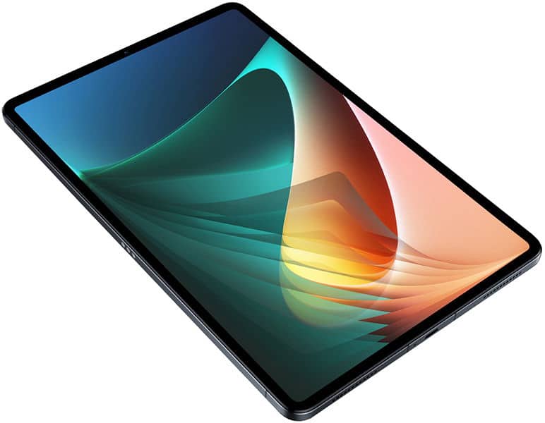 Front angled view of a black tablet with a vibrant abstract wallpaper in green, orange, and blue gradients on the display.