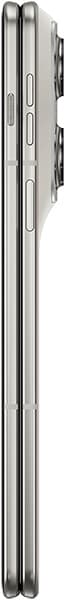 Motorola Razr Fold shown from the side in closed position, displaying the thin profile of the folded device with visible buttons and seams