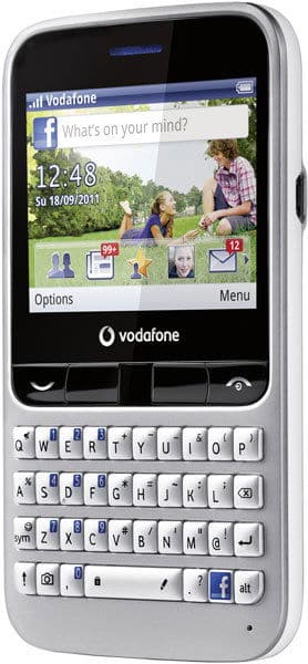 Alcatel 555 front view, silver phone with slide-out QWERTY keyboard, Facebook home screen displayed
