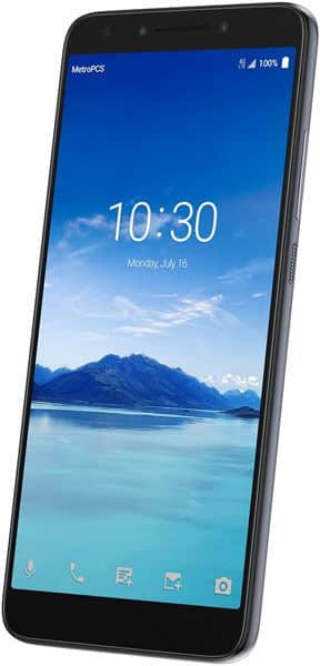 Front view of Alcatel 7 tilted right, lock screen at 10:30, July 16, with sea and mountain wallpaper under blue sky.
