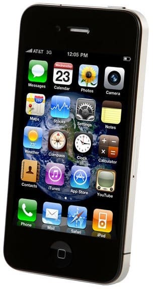 Front view of black iPhone 4 displaying app icons on touchscreen; time is 12:05 PM, date is Wednesday the 23rd.