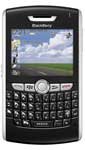 BlackBerry 8800 front view, displaying landscape photo on screen with QWERTY keyboard below
