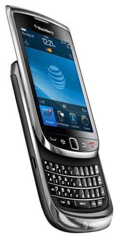 BlackBerry Torch 9800 front angled left, slide-out keyboard extended, AT&T logo and home screen visible on touchscreen.
