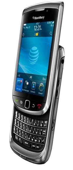 BlackBerry Torch 9800 front angled view with slide-out QWERTY keyboard open, home screen and AT&T logo visible on display.