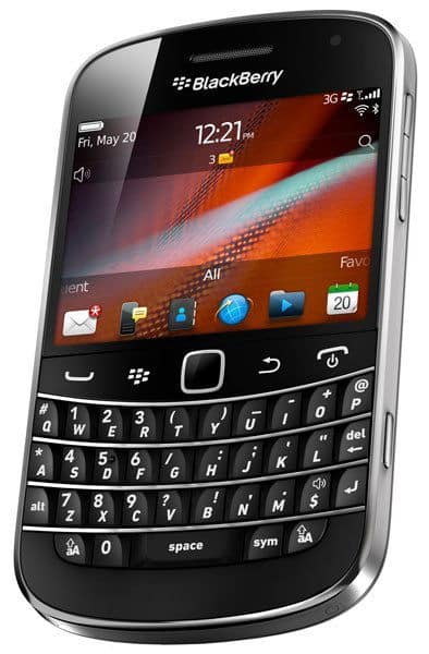 Front view of BlackBerry Bold 9900, physical QWERTY keyboard, home screen with app icons, date shown as Friday, May 20, 12:21 PM.