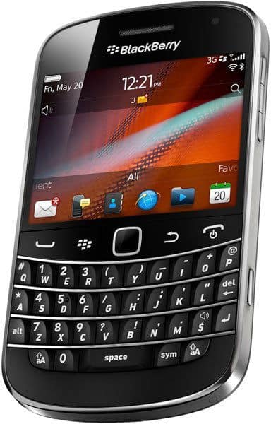 BlackBerry Bold Touch 9930 front view with screen on, displaying home screen with app icons and full QWERTY keyboard below