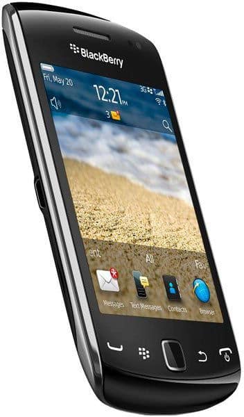 BlackBerry Curve 9380 front view, black smartphone with curved edges, touchscreen displaying home screen with time and beach photo wallpaper