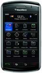 Front view of BlackBerry Storm showing home screen with app icons, time 12:21, and date Friday, October 3.