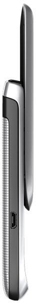 BlackBerry Torch 2 smartphone shown from the side, displaying its sliding QWERTY keyboard in the open position