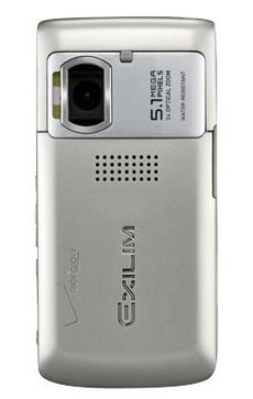 Casio EXILIM camera shown from the rear, displaying silver body with lens, speaker, and branding visible