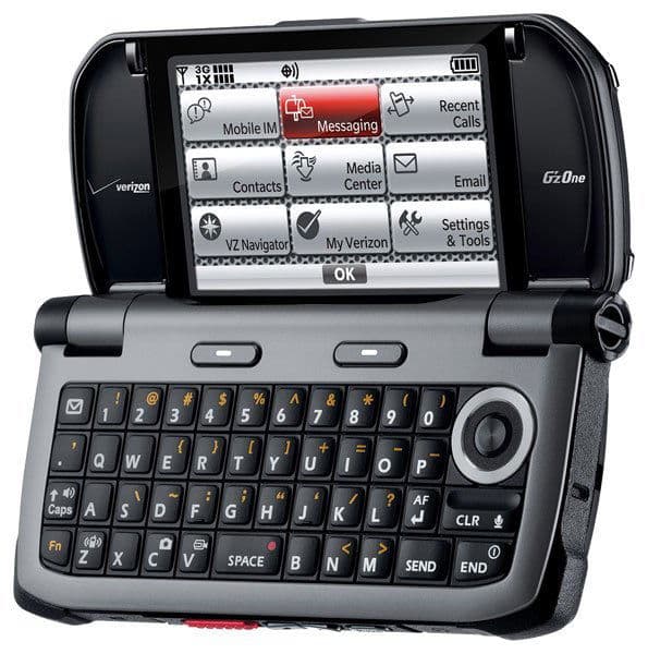 Casio Brigade G'zOne front view with screen open showing menu of applications including Messaging, Contacts, and Settings, and full QWERTY keyboard below