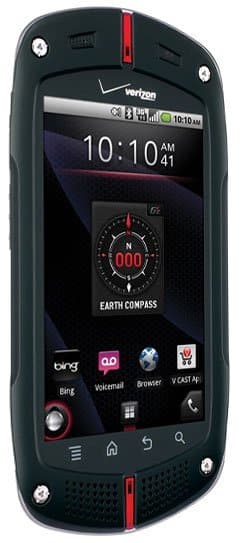 Front view of black Casio G’zOne Commando showing compass app, app icons, Verizon logo, and 10:10 AM on the screen.