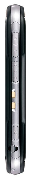 Side view of black and silver Casio G'zOne Commando showing buttons, gold connectors, and lanyard hole.