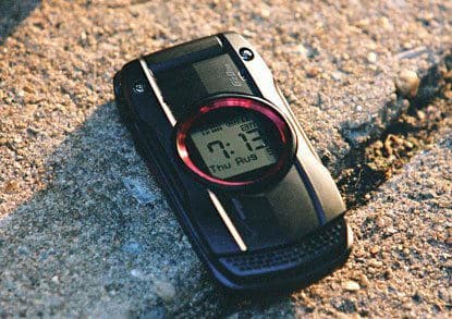 Casio GzOne Ravine phone, closed front view, showing digital display with time and red accent ring on black rugged body