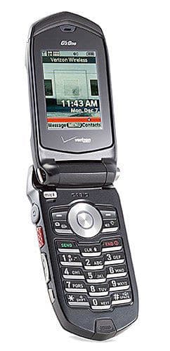 Casio G'zOne Rock open flip phone, front view, showing screen displaying time and keypad with numbered buttons