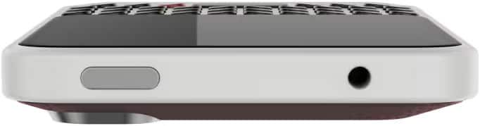 Bottom edge close-up of Clicks Communicator showing left-side button, right 3.5mm jack, plus partial keyboard and display above.