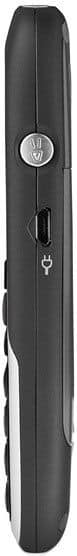 Side view of Doro PhoneEasy 520X in black, showing silver side button, charging port with cover, and edge of keypad.