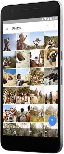 Google Nexus 6P displaying Photos app with grid of thumbnail images of people and outdoor scenes