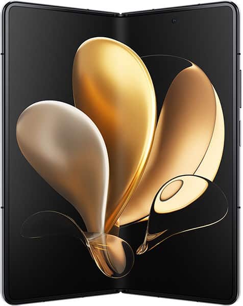 Honor Magic V open in book mode, displaying abstract golden petal shapes on dual screens against black background