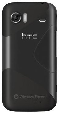 Rear view of black HTC 7 Mozart showing camera, flash, speaker grille, HTC logo, and Windows Phone branding.