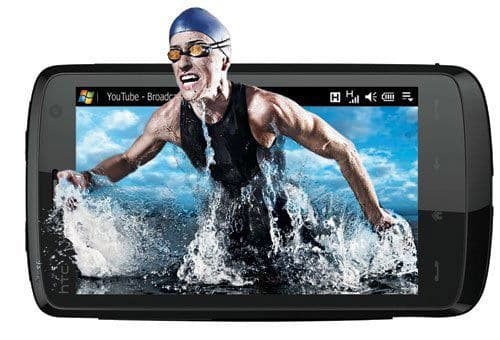 HTC HD2 Touch front, displaying video of person swimming in water on screen
