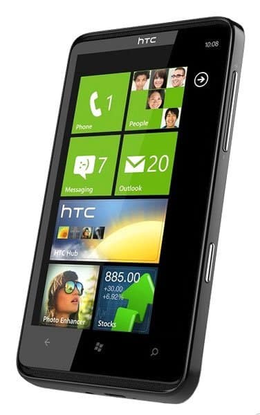 HTC HD7 front view with Windows Phone home screen displaying tiles for Phone, People, Messaging, and Outlook apps