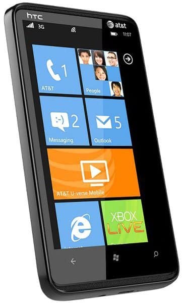 HTC HD7S front view, Windows Phone with colorful tiles showing AT&T, People, Messaging, Outlook, video, and Xbox Live apps